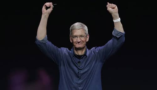 Apple CEO Tim Cook introduces Apple Watch , which he is wearing on his wrist, on Tuesday, Sept. 9, 2014, in Cupertino, Calif. (AP Photo/Marcio Jose Sanchez)